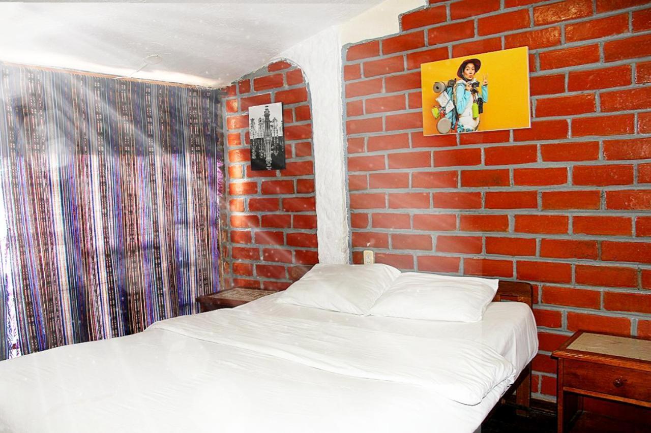באניוס Hostal Inti Raymi Backpackers מראה חיצוני תמונה